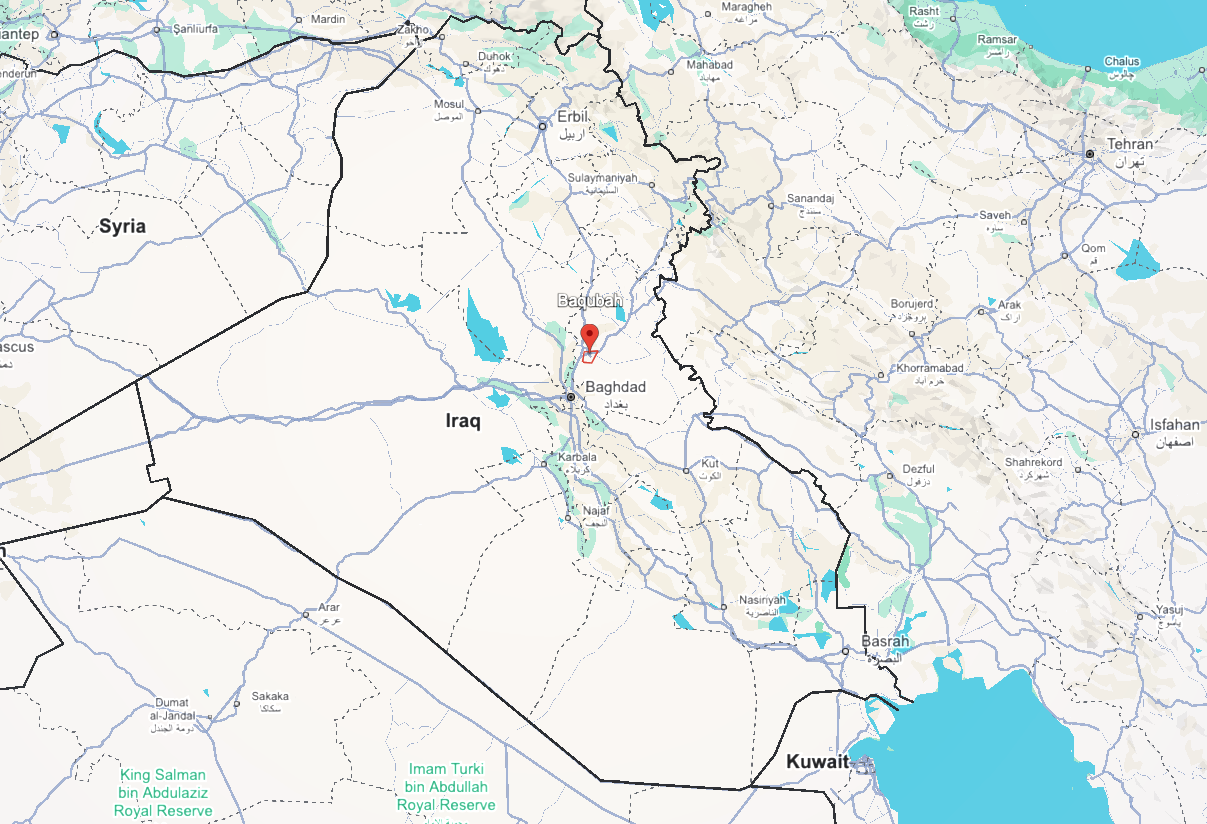 map of central and western Iraq, showing the Tigris and Euphrates rivers winding through a desert landscape. Several major cities are labeled, including Baghdad, Ramadi, and Tikrit. A red pin and a hand-drawn red outline highlight a specific area just north of Baghdad, near the city of Baqubah. To the west, the Syrian border is visible, and to the east, the mountainous terrain of the Iranian border. map of central and western Iraq, showing the Tigris and Euphrates rivers winding through a desert landscape. Several major cities are labeled, including Baghdad, Ramadi, and Tikrit. A red pin and a hand-drawn red outline highlight a specific area just north of Baghdad, near the city of Baqubah. To the west, the Syrian border is visible, and to the east, the mountainous terrain of the Iranian border.