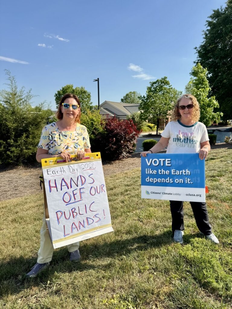 Wake Forest Earth Day protest - activists holding signs at Rogers Rd intersection