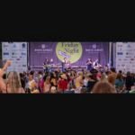 Friday Night on White concert - band performing on stage with large crowd on South White Street, Wake Forest NC