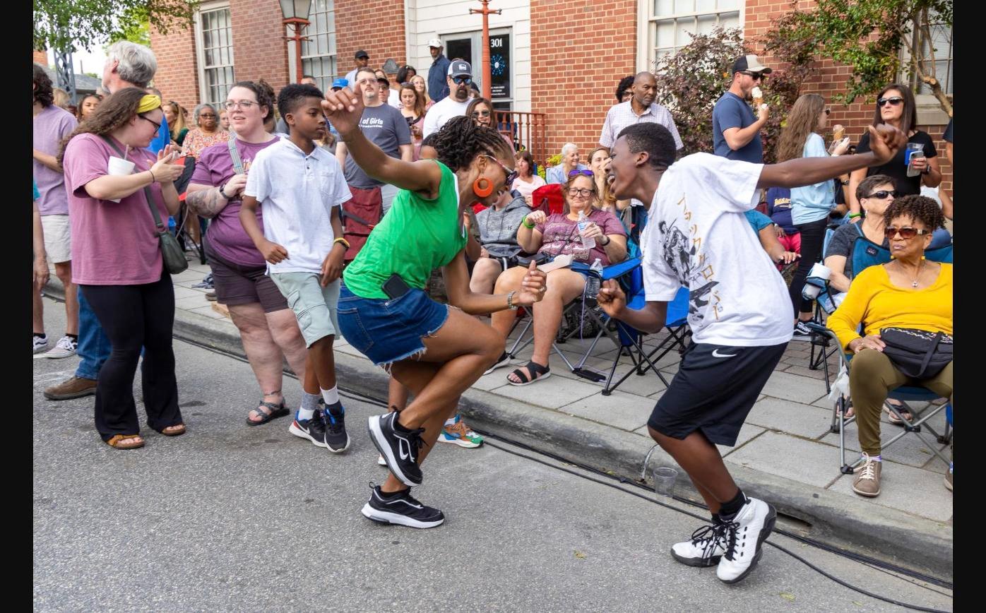 People dancing on South White Street during Friday Night on White in downtown Wake Forest, NC